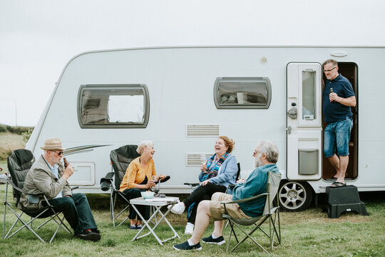 Group of senior people gathering outside a trailer