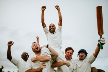 Cheerful cricketers celebrating their victory
