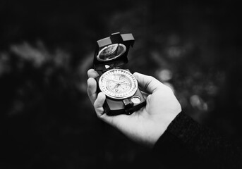 Man checking a compass for direction