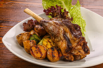 Baked lamb leg with vegetables