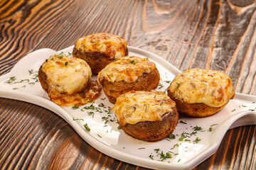 Baked champignon with cheese and herbs