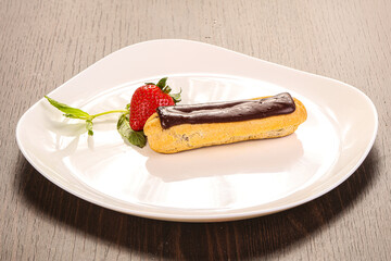 Sweet tasty eclair with chocolate
