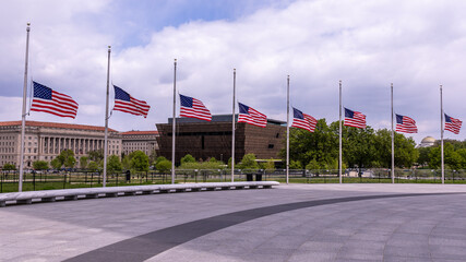 View at National Museum of African American Black American History and Culture behind the US flags...