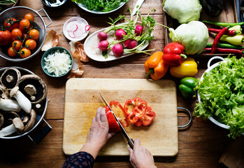 A person slicing vegetables