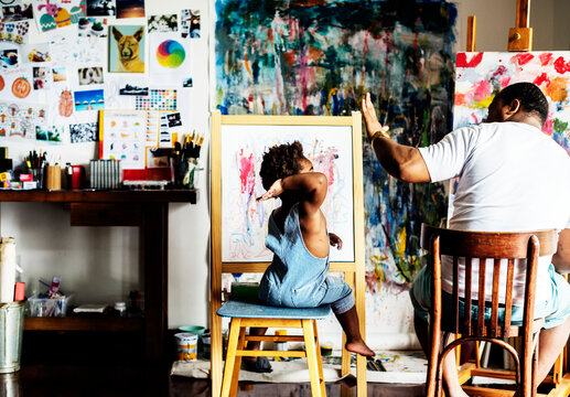 African Descent Artist Dad Giving His Child A High Five