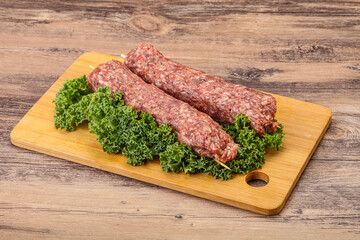 Raw minced beef kebab skewer