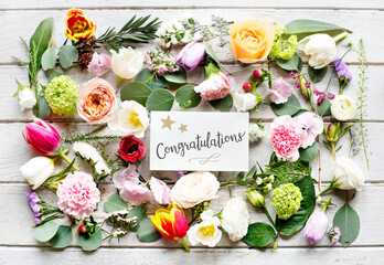 Obraz na płótnie Canvas Diverse Flowers with Congratulations Card