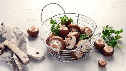 Champinion mushrooms on light background. Vegan food concept.