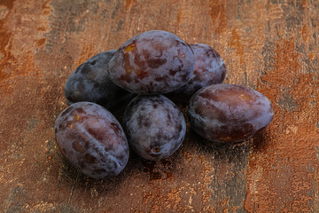 Purple sweet ripe plum heap
