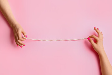 Women with beautiful manicure and necklace on color background - obrazy, fototapety, plakaty