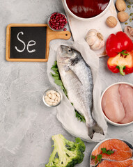 Food high in selenium on light gray background. Healthy eating concept.