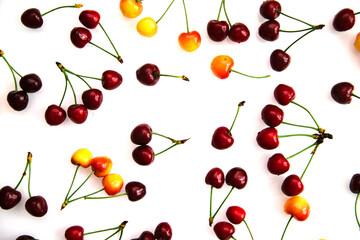 Naklejka na ściany i meble Red and yellow ripe cherries. Summer background of juicy fruits.