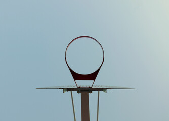 Breakaway basketball rim with clear sky