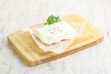 Greek Feta cheese over board