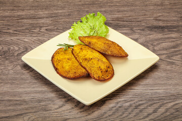 Baked potato with herbs and spices