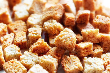 baked white bread croutons close-up