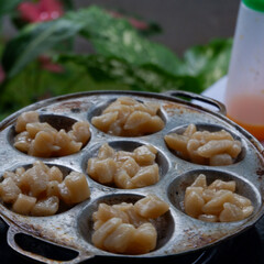 Sausage and nuggets fried with spicy spices on top, strawberry syrup drink