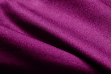 Fototapeta na wymiar 布テクスチャ背景 赤紫色の厚手の布地