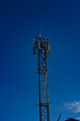 communication tower at ski slope near the city summer