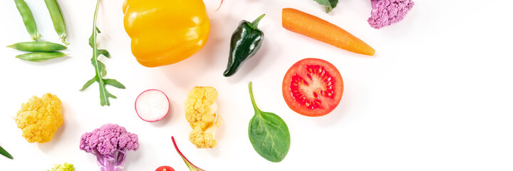Vegetable panorama with copy space. Various fresh produce, shot from the top on a white background. Healthy summer salad ingredients