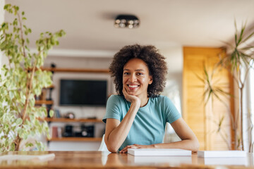 Adult woman, thinking about her day, while taking a picture.