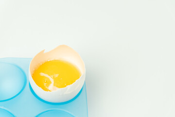 One broken egg with yolk