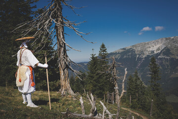 European Shugendo monk in traditional outfit hiking in the Austrian mountains, Austrian, Ötscher - obrazy, fototapety, plakaty