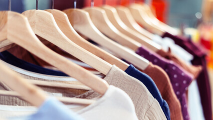 Summer cotton handmade dresses hang on a hanger in the store.