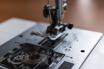 Production line sewing machine. Needle and footstep detail