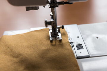 Production line sewing machine. Needle and footstep detail