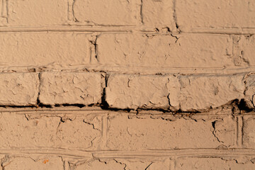 Old wall of bricks dull colors.