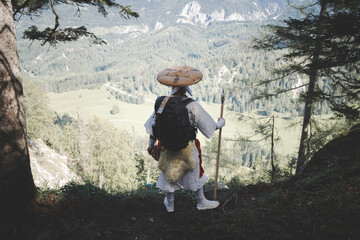 European Shugendo monk in traditional outfit hiking in the Austrian mountains, Austrian, Ötscher - obrazy, fototapety, plakaty
