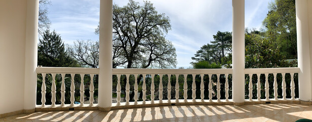Fototapeta premium View of the large sun-drenched balcony