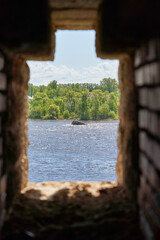 Observation window in the brick wall of the fortress for firing a gun with