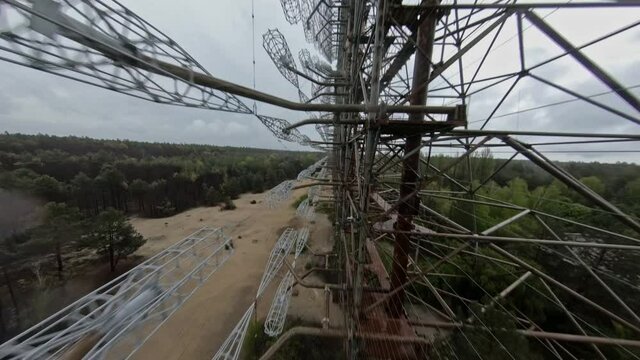 FPV drone view of over horizon duga radar system in the rain. The Chernobyl Exclusion Zone