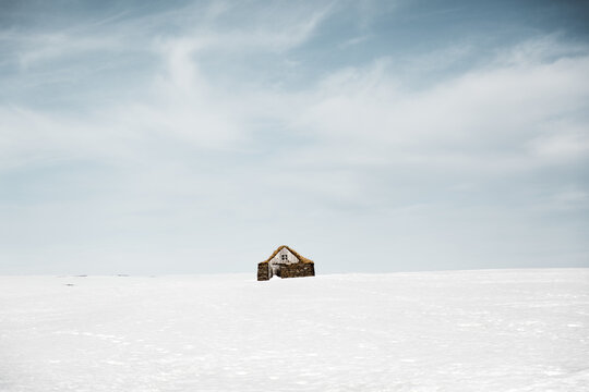 Small hut in snowy countryside
