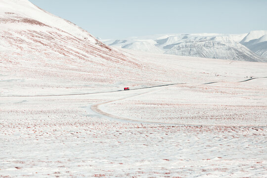 Red lorry in endless winter valley