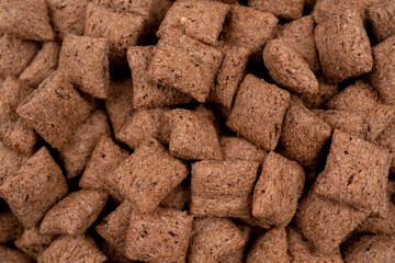 chocolate pillows background texture, brown chocolate cereal pads pattern,