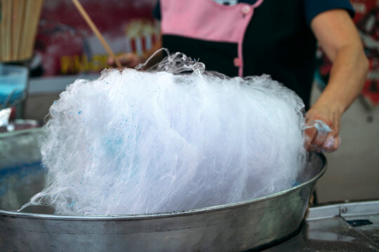 Unrecognizable person preparing the cotton candy machine