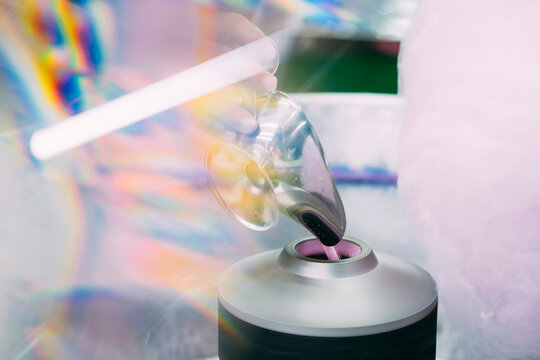Unrecognizable person preparing the cotton candy machine
