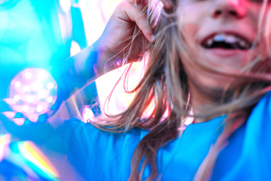 Little girl having exciting experience in the roller coaster