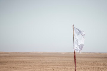 White flag in arid desert