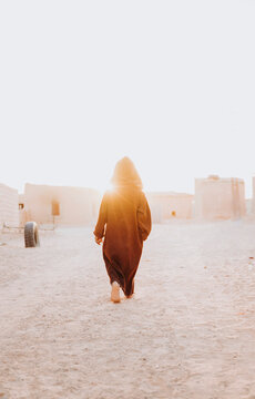 Back view of ethnic kid walking