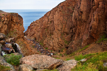 Landscapes of the Murmansk region. Waterfall on Small Battery Lake, Teriberka, Russia.