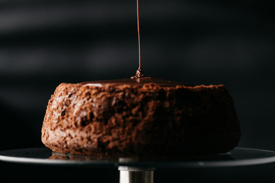 Chocolate ganache falling on cake
