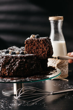 Delicious chocolate cake with cut piece