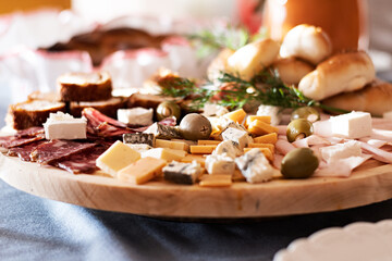 Traditional dinner for Serbian slava. Cheese variety, nuts, Mediterranean olives, Prosciutto di...