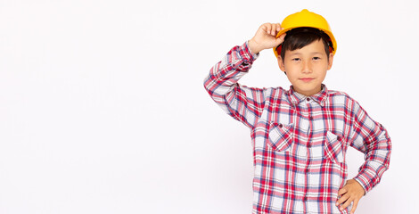 Close-up of an Asian boy wearing a hardhat smiling and looking at camera, standing isolated on white background. banner with copy space