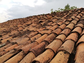 Roof tile. Red tile. Old building tile.