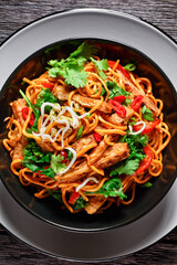 grilled soy meat strips with egg noodle in a bowl